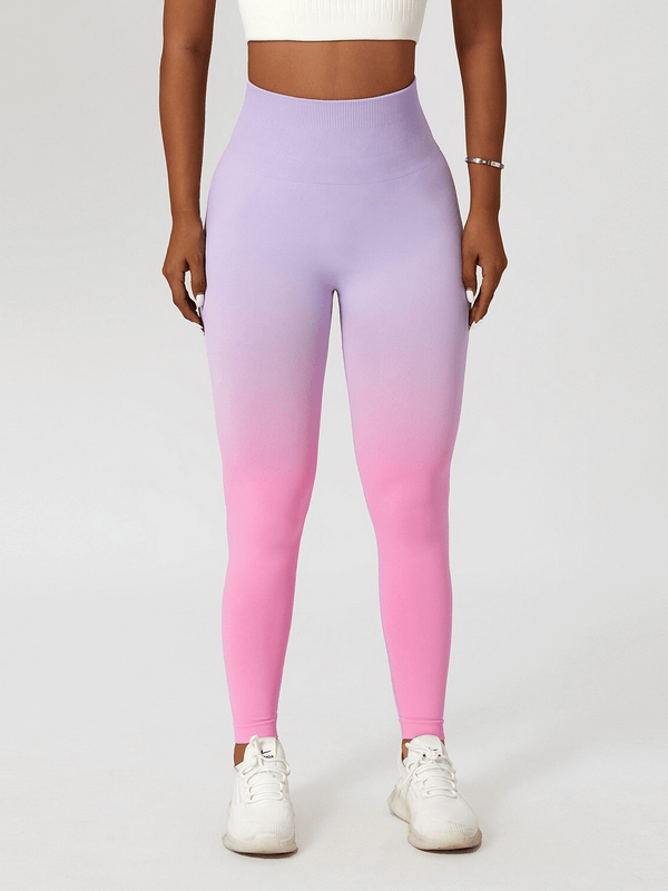 Women's gradient seamless high waist yoga leggings in purple and pink, perfect for active lifestyles and flexibility.